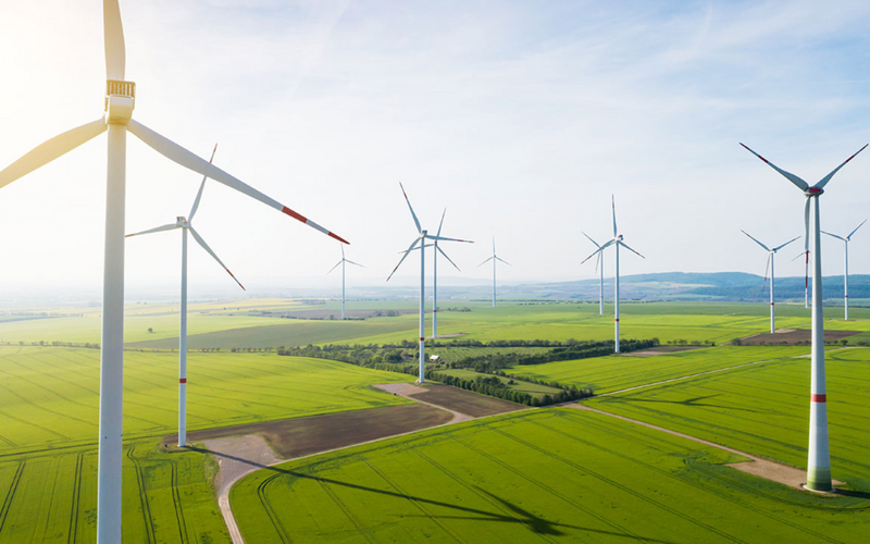 Team picture of Vallum outside building discussing recruitment